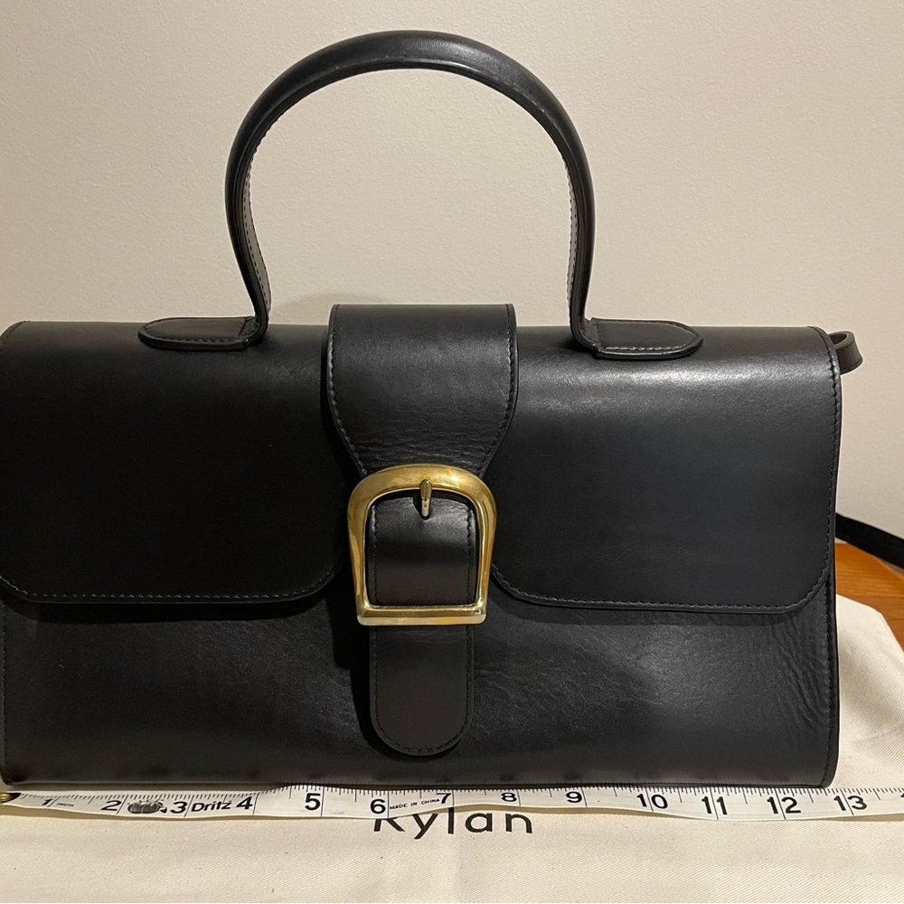 Black top handle leather bag
